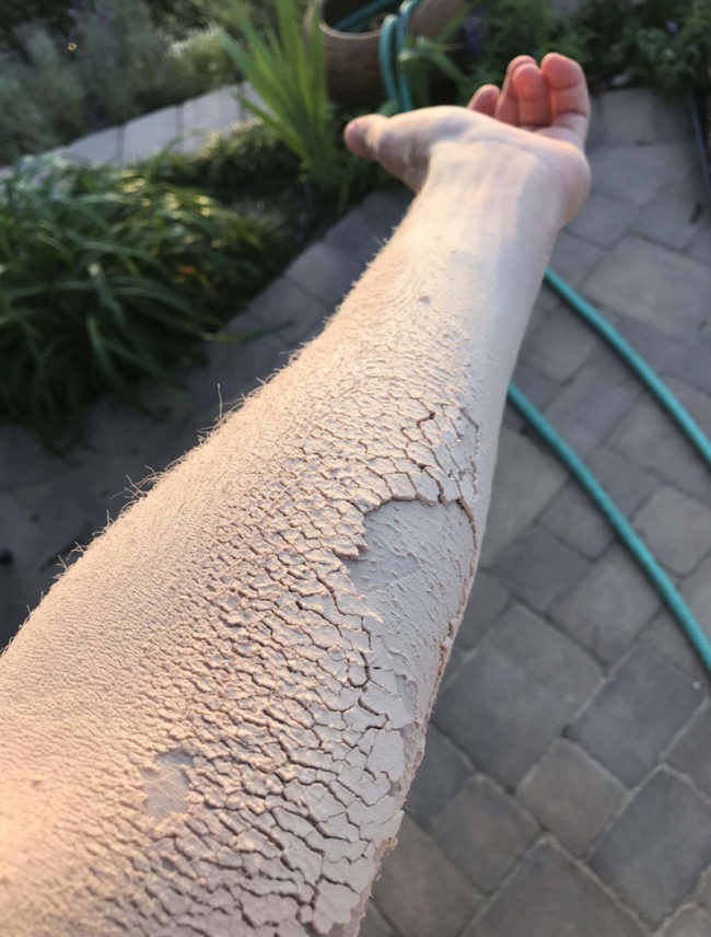 Wood dust makes this arm look like dry, cracked dirt