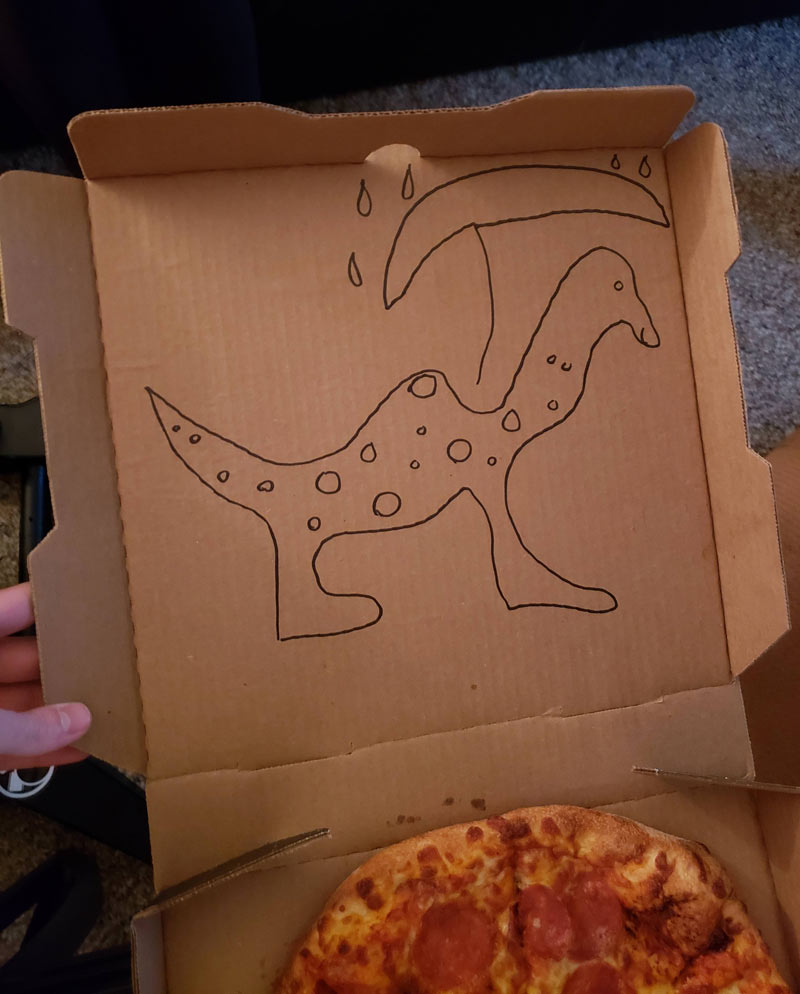 Ordered a pizza online, wrote "Draw a dinosaur on the box" that auto-corrected to "Dry dinosaur on the box". This is what was delivered