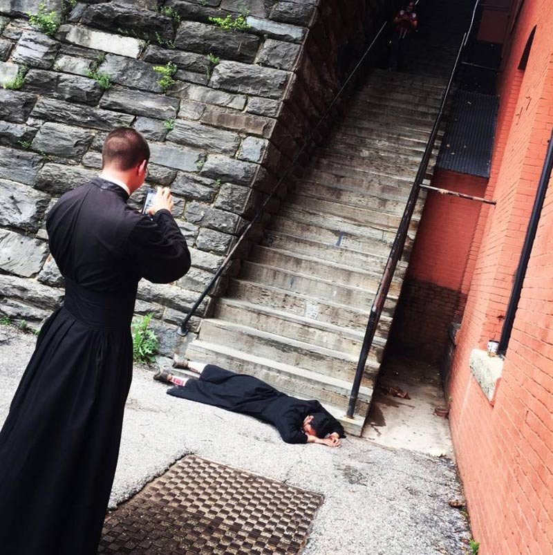2 priests snapping photos at the exorcist steps in Washington DC