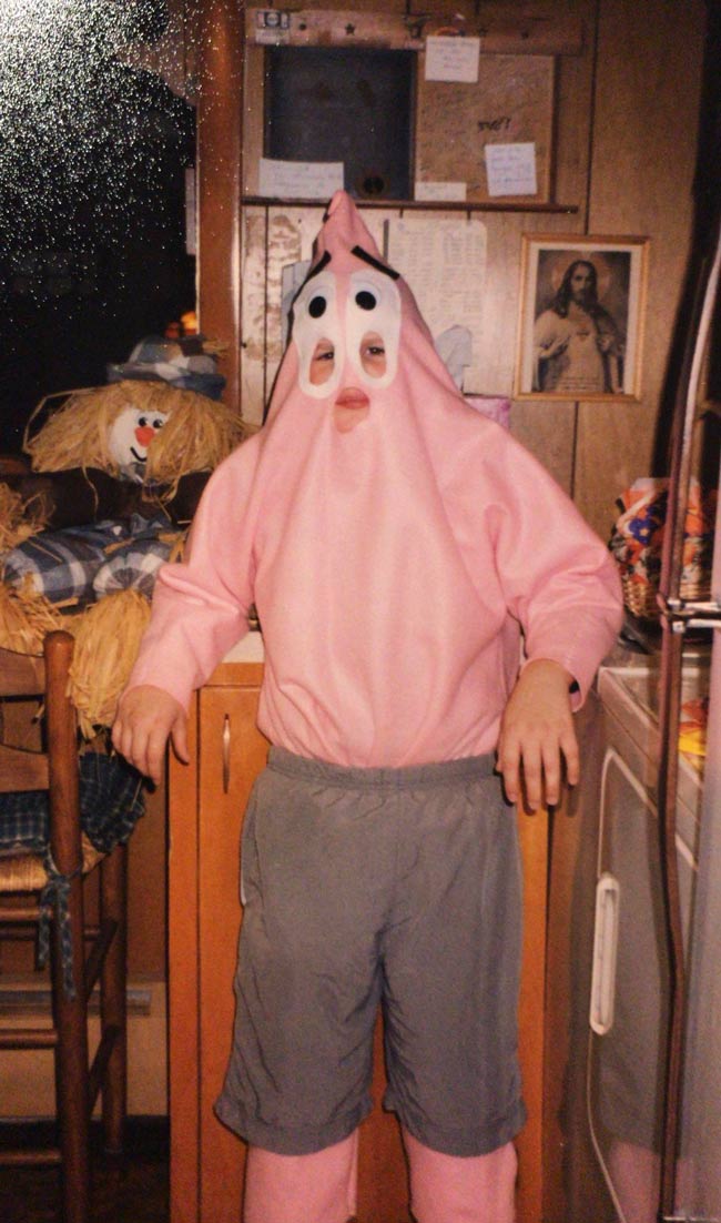My brother posing in his Halloween costume handmade by our mother. (2001)