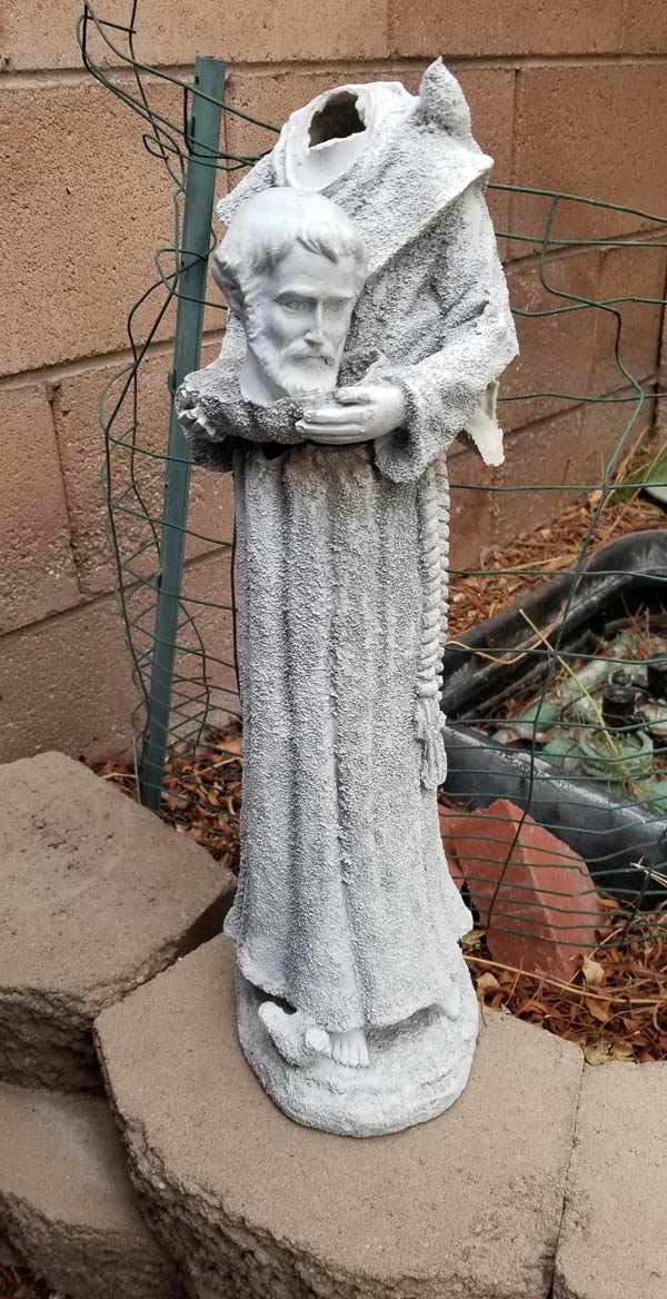 Wind knocked over this statue. My 3 year old fixed it
