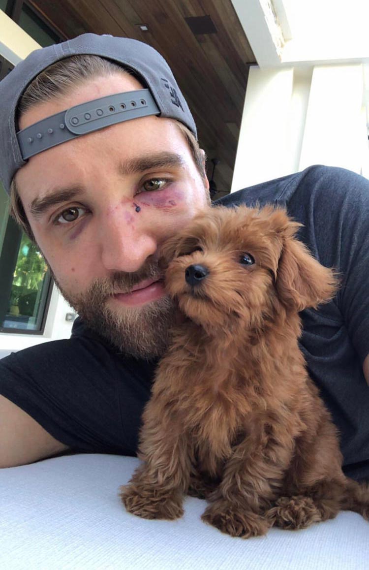 This hockey player and his puppy