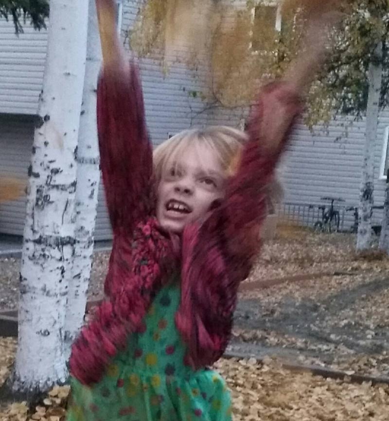 Tried to get some cute pics of the kids throwing leaves