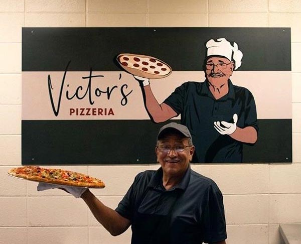 My college is finally giving our tireless pizza chef the credit he deserves