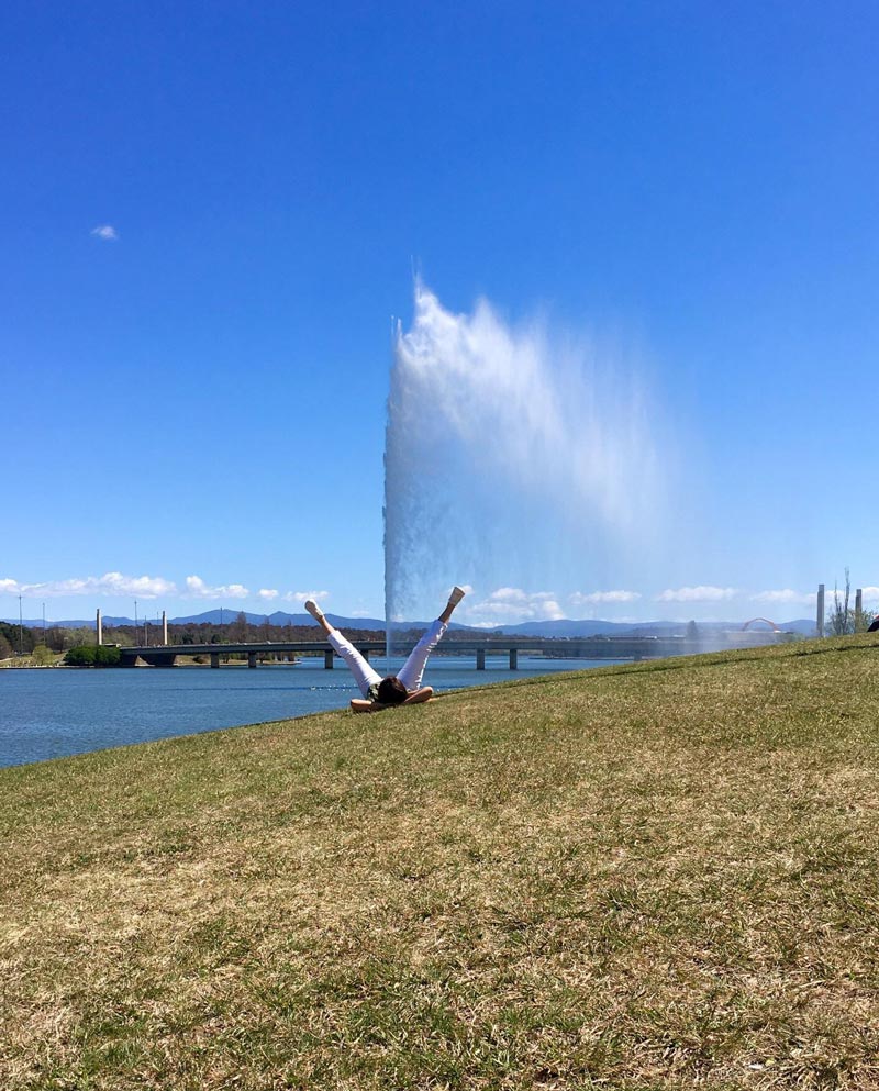 My tourist photo in Canberra, Australia, in front of the Captain Cook Memorial Jet on Lake Burley Griffin