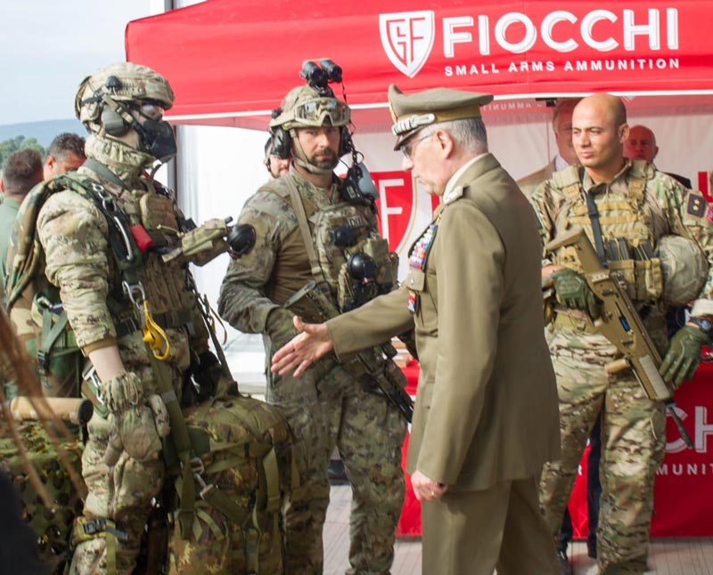 Italian Army General Claudio Graziano trying to shake hands with a military dummy during an official event, 2018