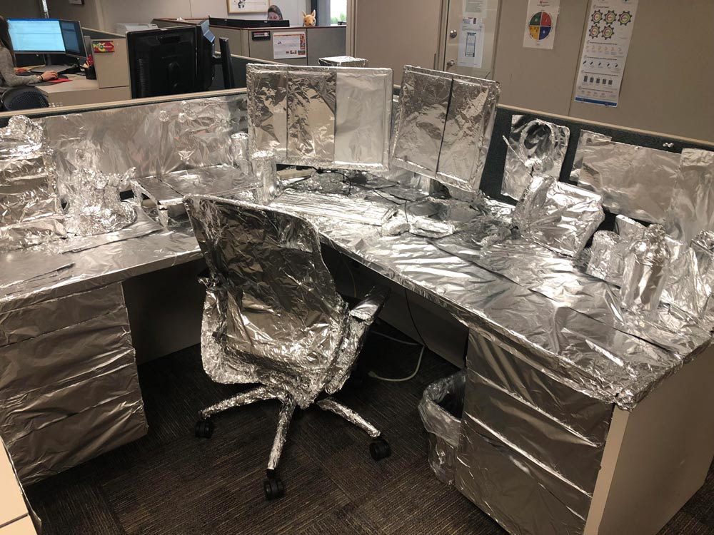 Came back from a long vacation to literally every single thing on my desk wrapped in tinfoil