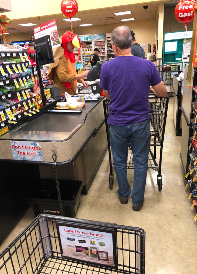 This cashier dressed as a turkey has been gobbling over the intercom every few minutes