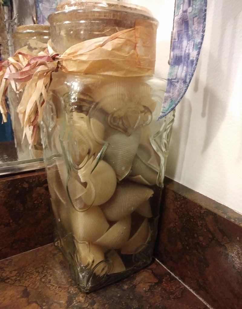 Was cleaning my mom's bathroom and realized that this jar that's been sitting there for 15 years is not filled with sea shells. It's filled with pasta shells..