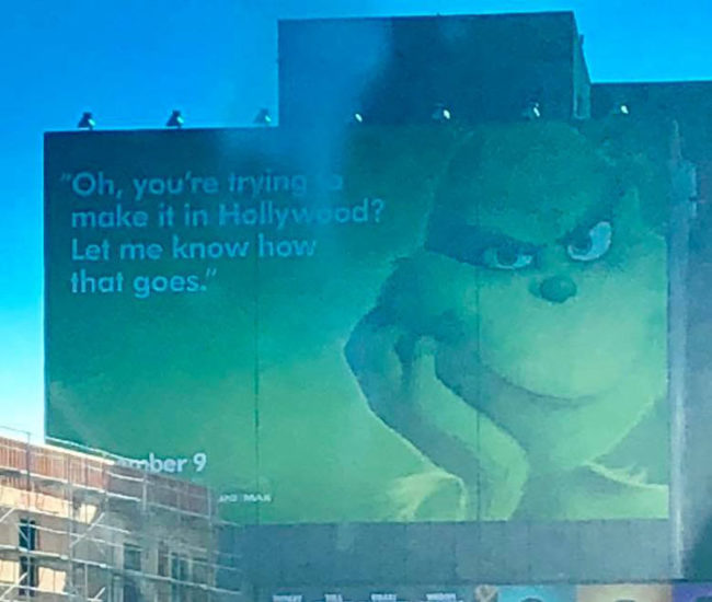 The Grinch on a billboard in Hollywood, crushing everyone's dreams
