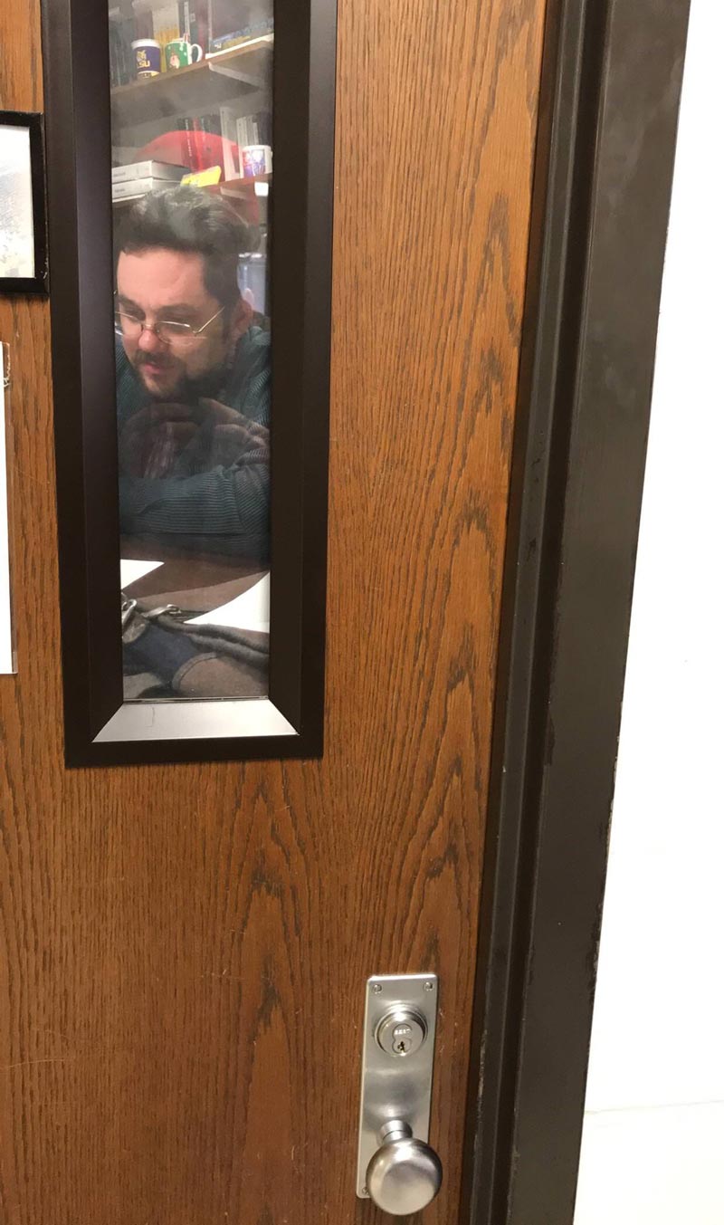 Teacher put up a picture of himself on his door so it looks like he’s always in his office