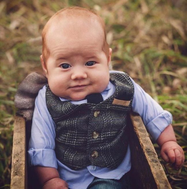 This baby looks like he’s ready to pour you a pint at his pub