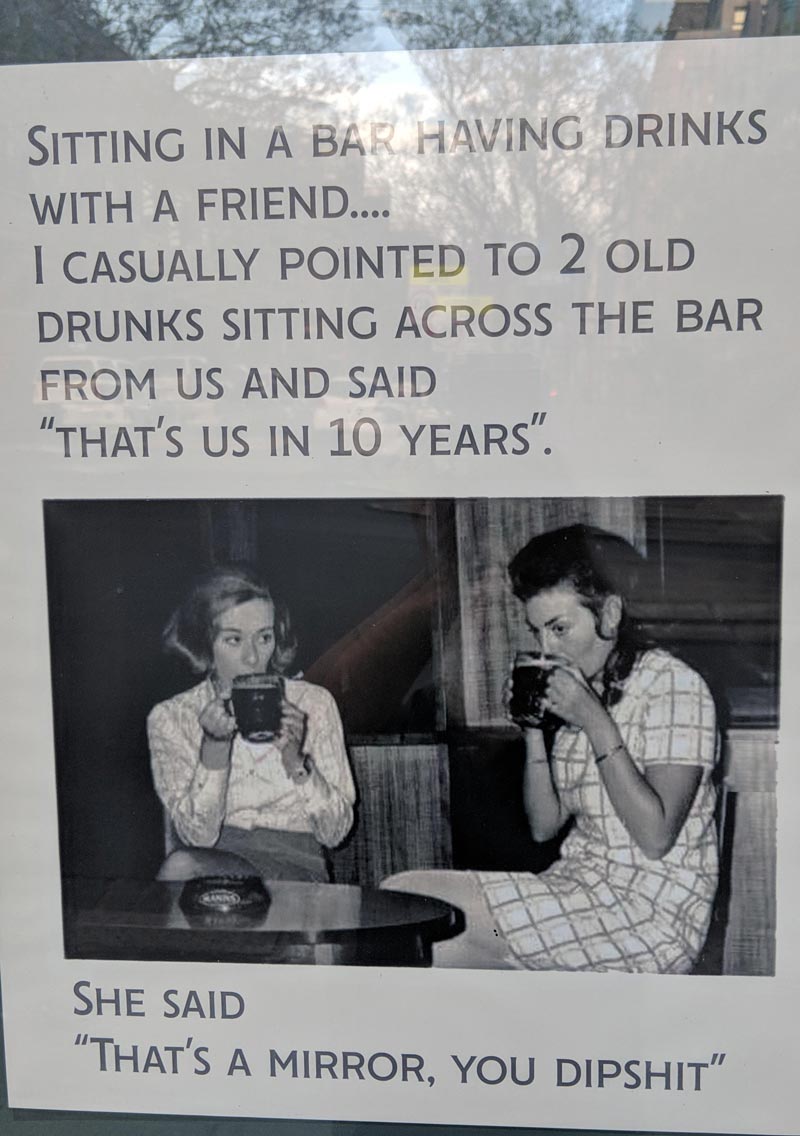 This poster is in the window of a pub in Sydney
