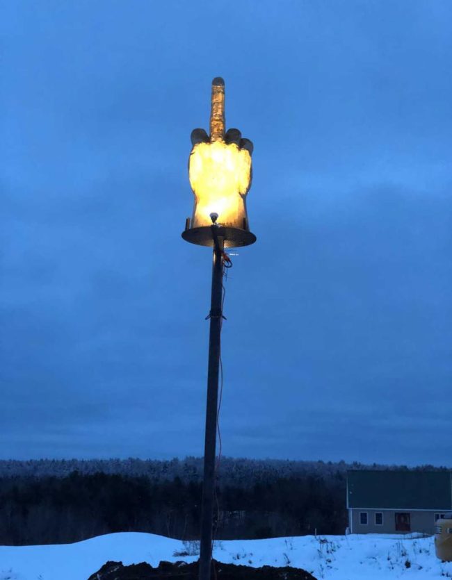 A guy spent $4,000 on this 16 foot tall middle finger sculpture, to spite the city authorities who won't let him build an 8,000-square-foot garage on his 11-acre property