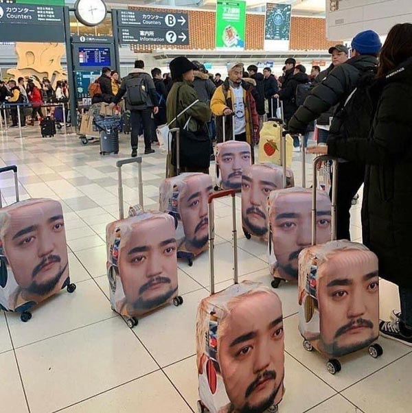 Best way to stop losing luggage... Put your tour guide’s face on it!