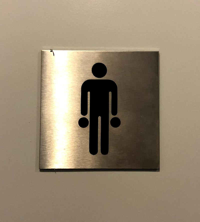 This bathroom sign in the offices of an airport