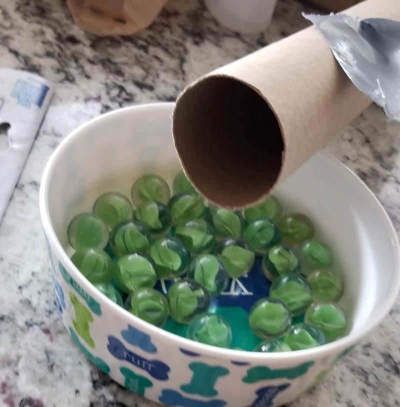 My wife likes to shake her presents when I'm away, so I'm putting a cardboard tube full of marbles in with her gift