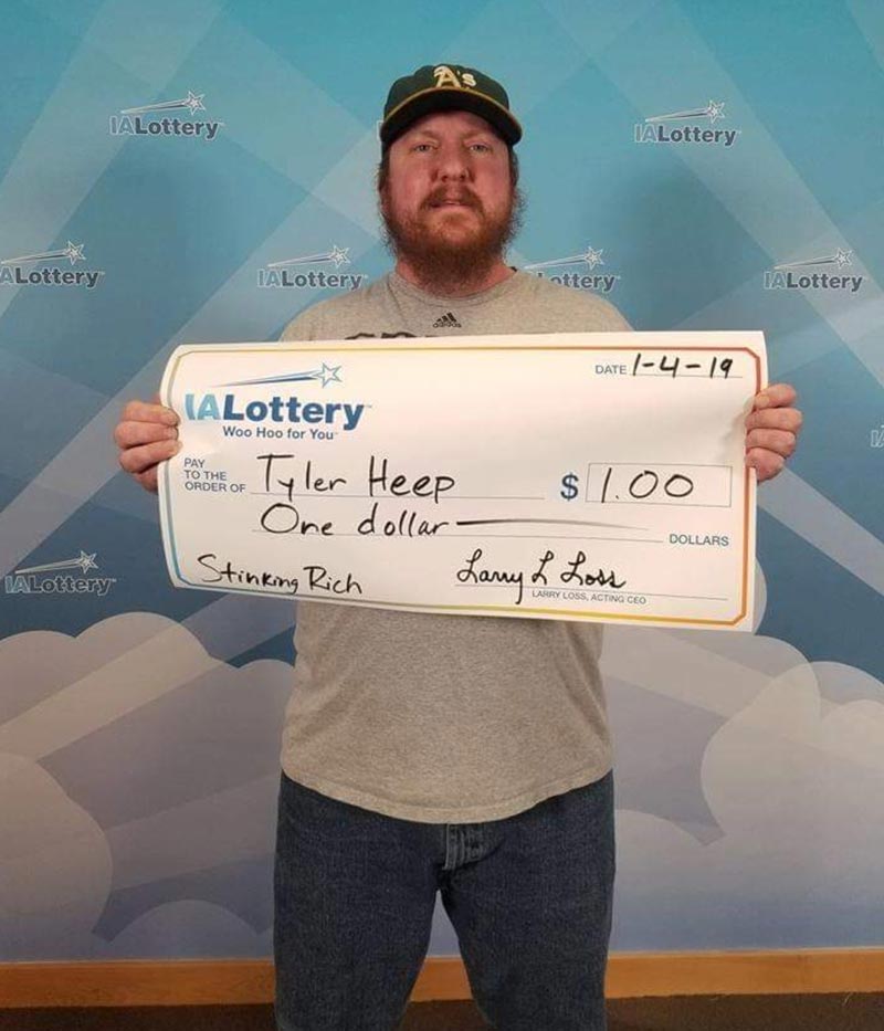Guy who won one dollar on the lottery asked to be paid with giant cheque
