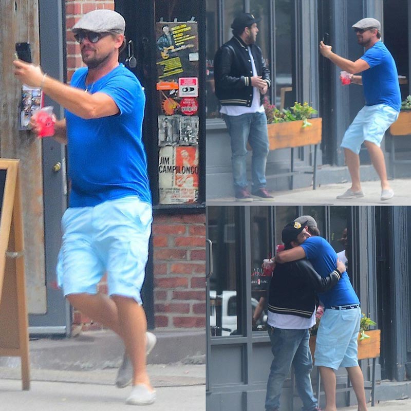 Leonardo DiCaprio running up to Jonah Hill, pretending to be a fan