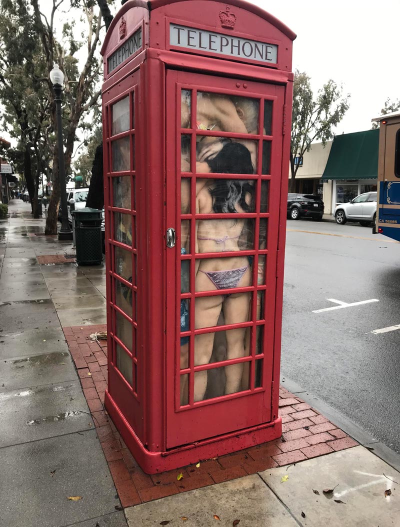Sex dolls stuffed into a telephone booth. Laguna Beach, CA