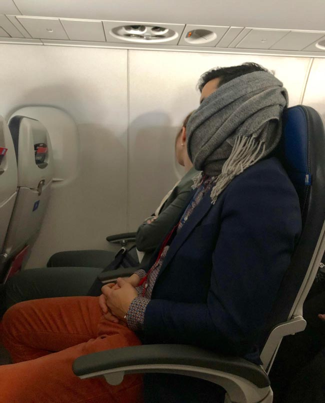 Shout-out to this hero. He woke himself up snoring, covered his mouth with his scarf, and went back to sleep. All I could hear was a slight rumble after that