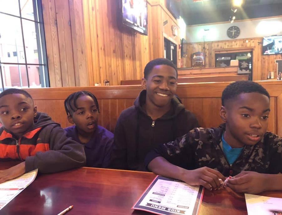 A guy I know from work took his sons to Hooters for the first time and captured this