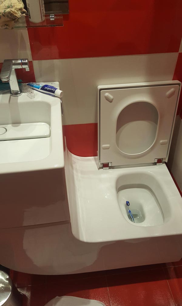 Sink attached to the toilet, forming a perfect slide