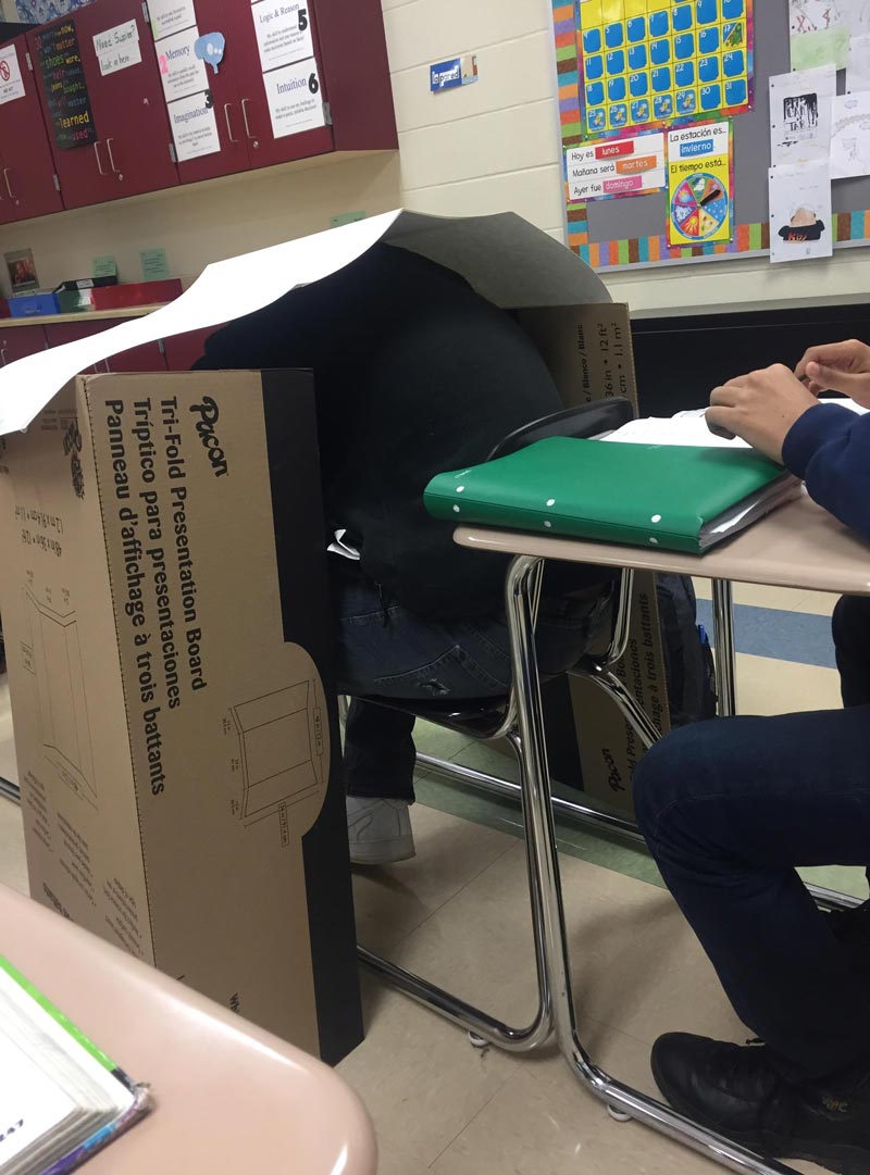 My teacher likes messing with kids that fall asleep in class. Today he built a small shelter for a napping kid next to me