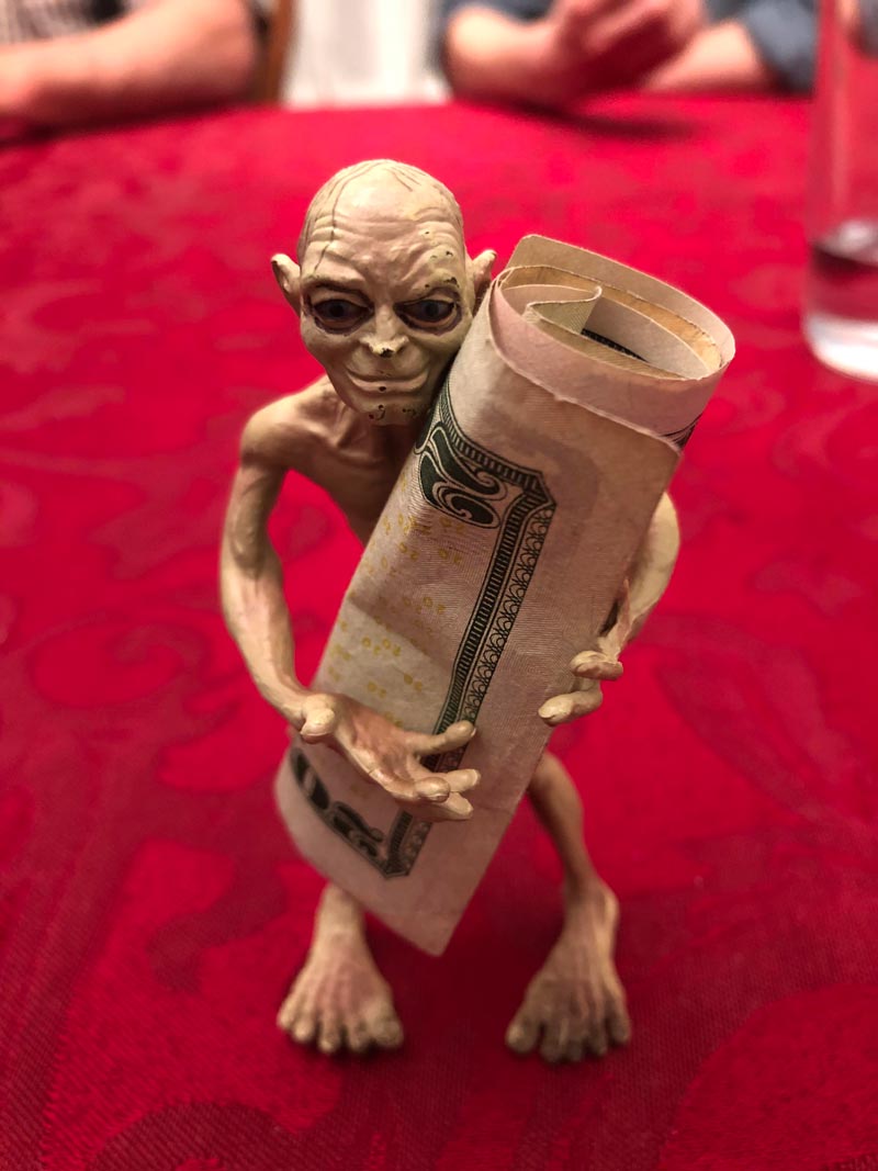 My family and I use this Gollum toy to hold the money when we play cards