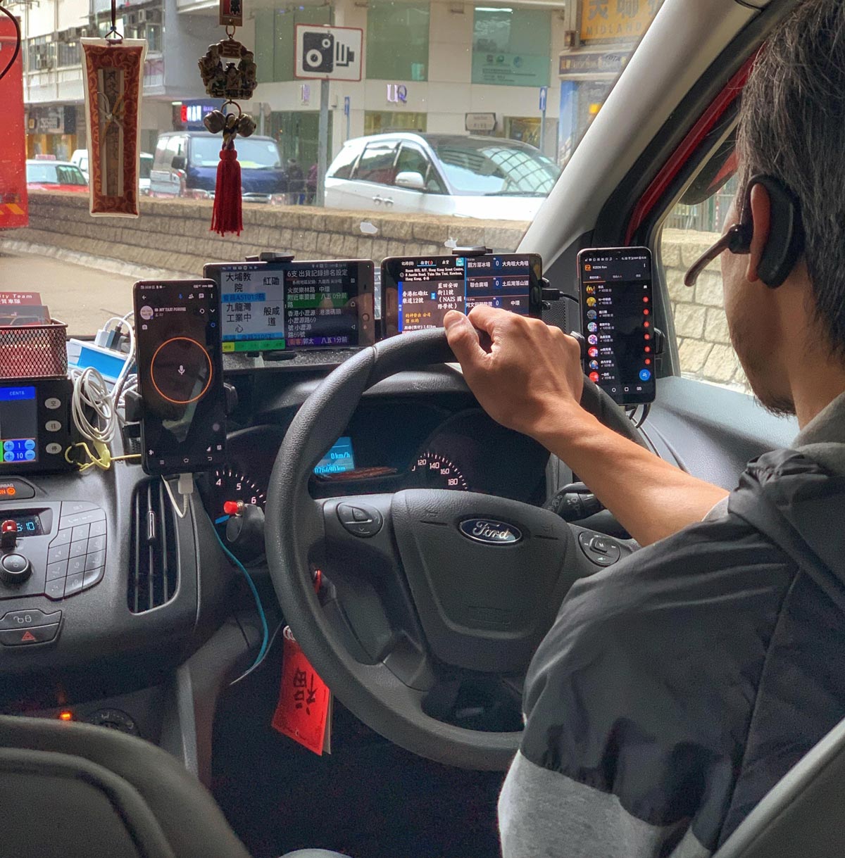 My cab driver in Hong Kong plays Scrabble and controls the Hubble while getting me to the airport