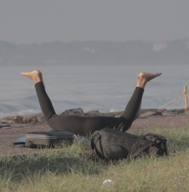 My wife doing yoga on the beach