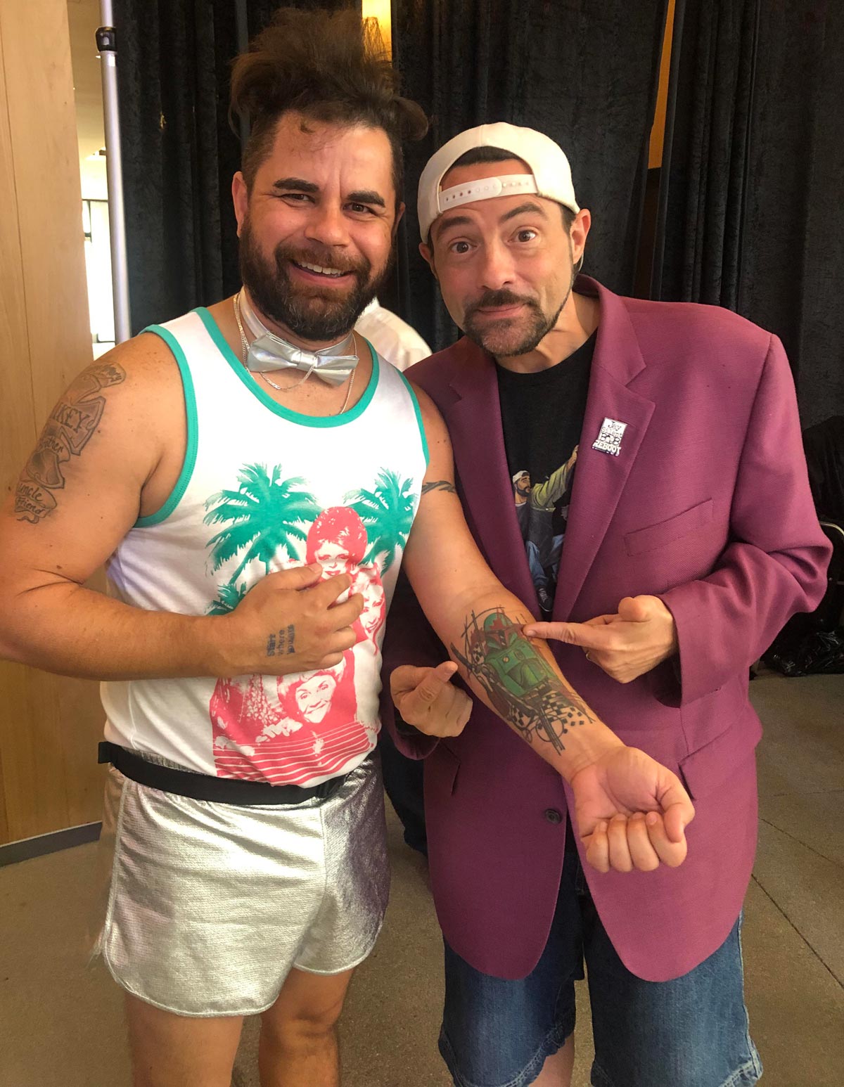 I am not sure if Kevin Smith getting a picture with my tattoo was funnier than my outfit. My girlfriend and I were at DayBreaker event just to be clear