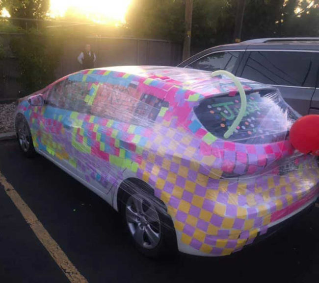 My friend got married today and his car got covered in sticky notes and plastic wrap. Kudos to the artist and his skills