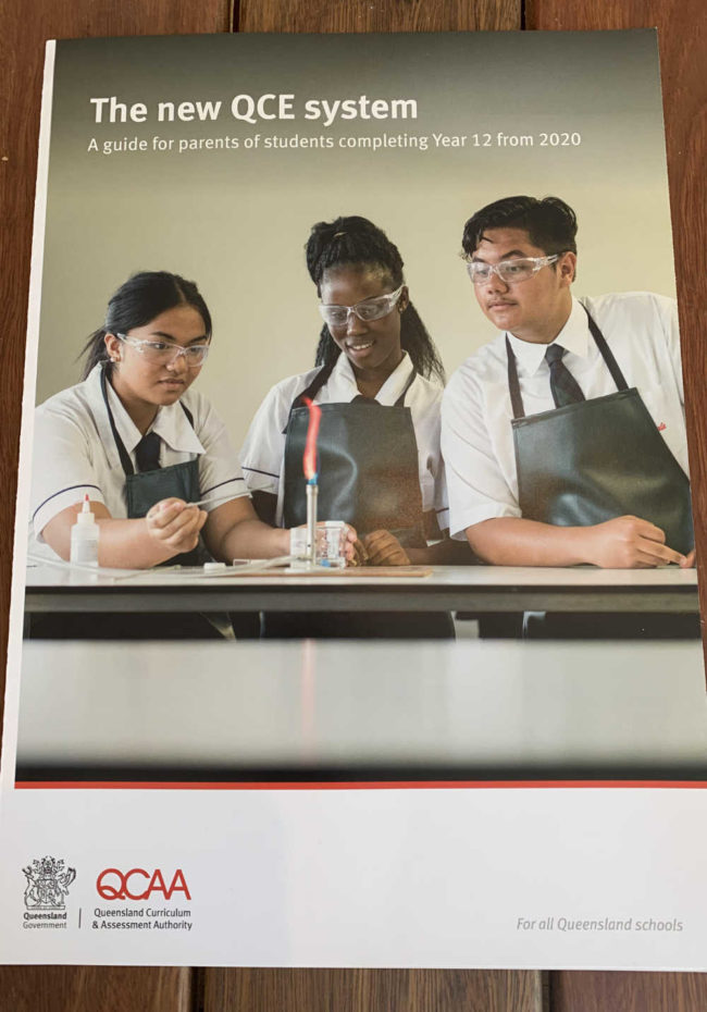 The kid on the right successfully trolled the State Education Department on the cover of a publication that has now been sent out to a million families