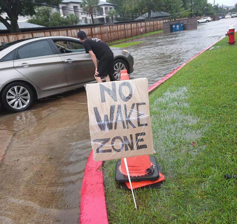 My parking lot flooded but people still speed through so I made a sign