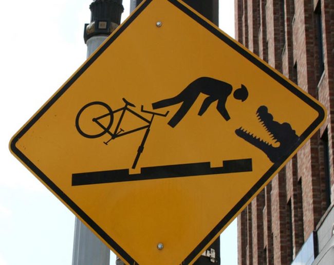Be careful when riding your bike on bumpy roads, especially near hungry alligators
