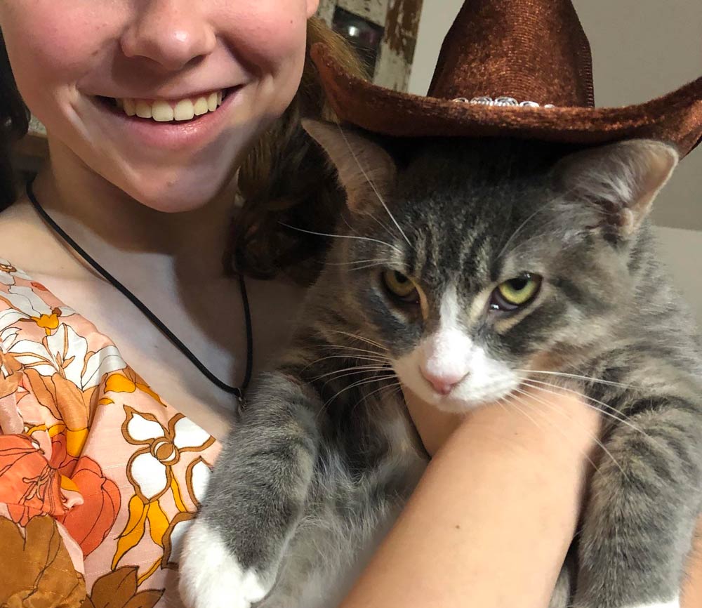 My daughter bought the cat a new hat at Goodwill. He’s so excited