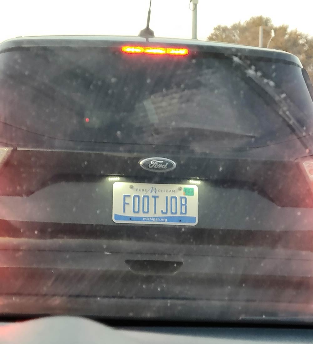 I can't tell if the guy in front of me is a podiatrist or just likes to advertise his fetishes