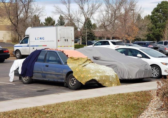 A co-worker trolling another with the fancy car cover