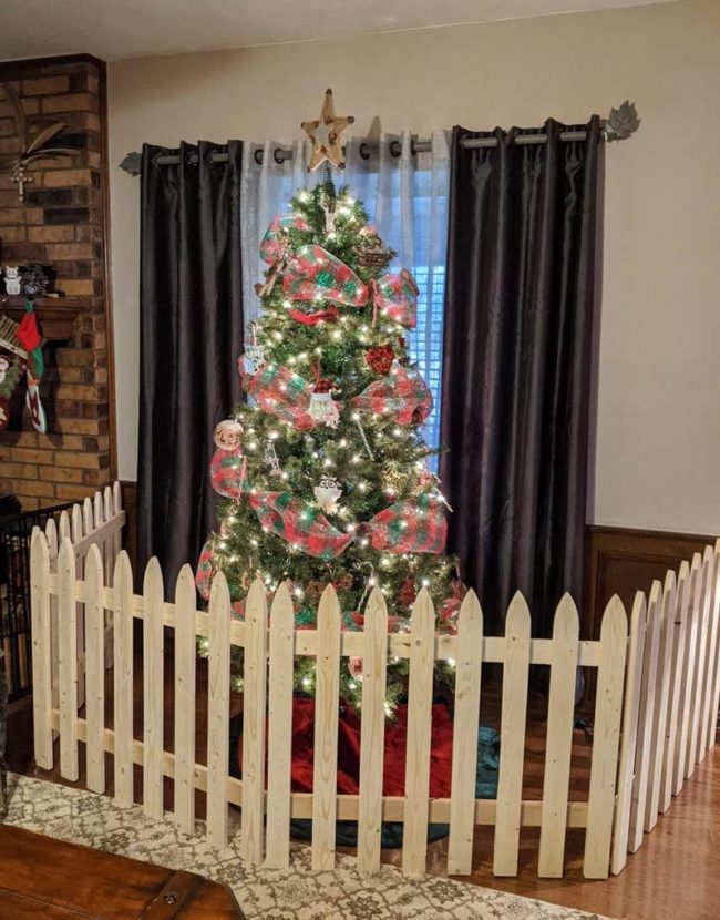 My dad made a little fence for my mom's Christmas tree because her dog keeps trying to eat the gifts and ornaments