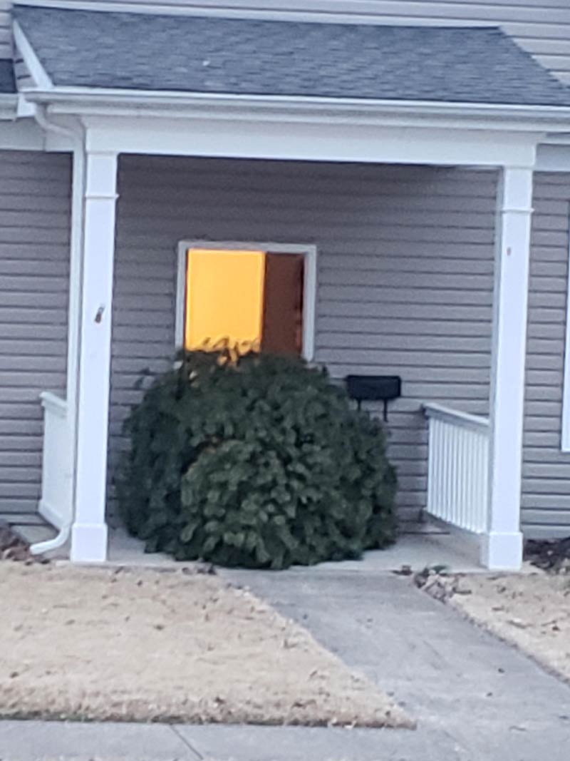 My neighbor's Christmas spirit is bigger than his door