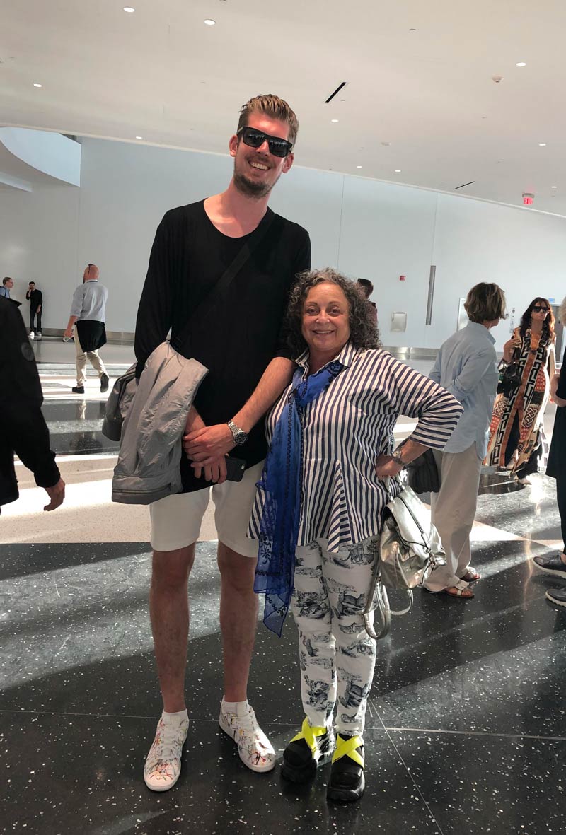 My short mom sends our family photos of her with really tall people