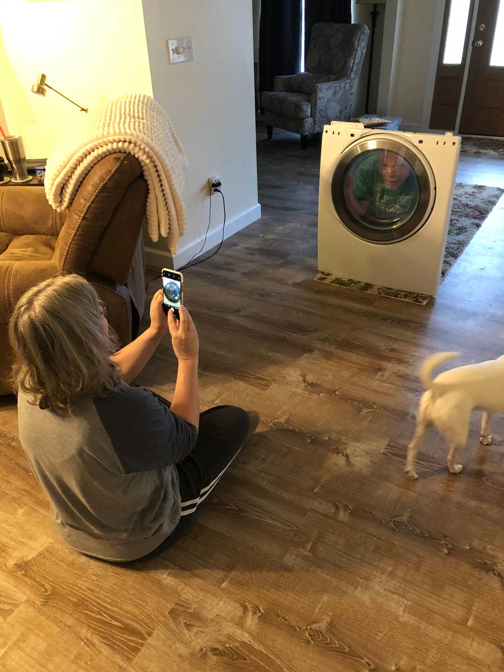 This is what true love looks like. My mom taking a picture of my dad pretending he’s stuck in the dryer