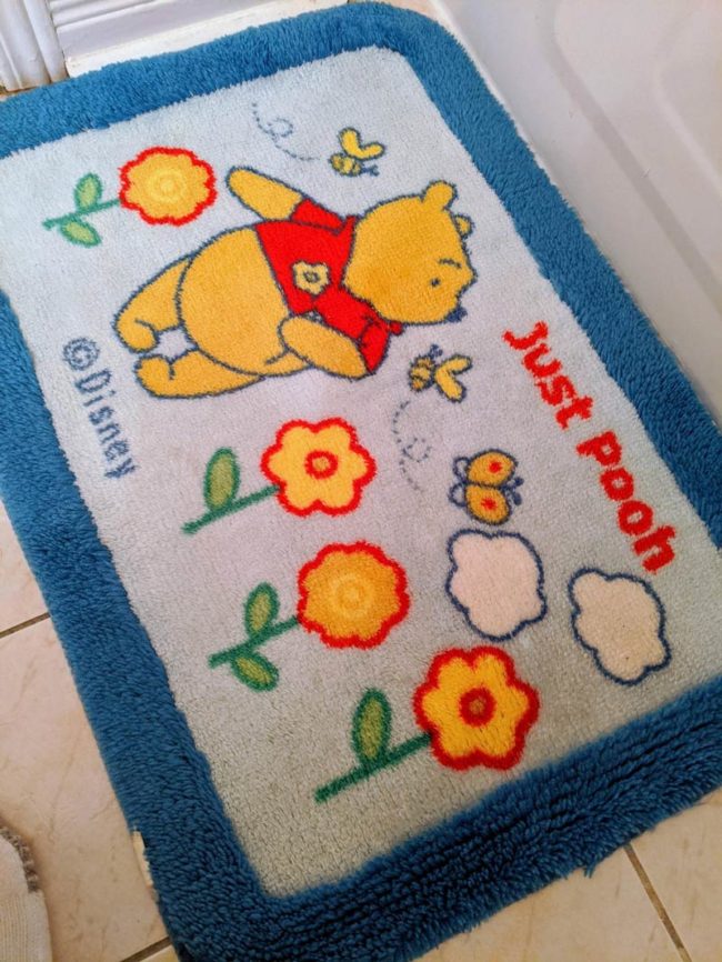 My wife's old bath mat is offering me words of encouragement this morning
