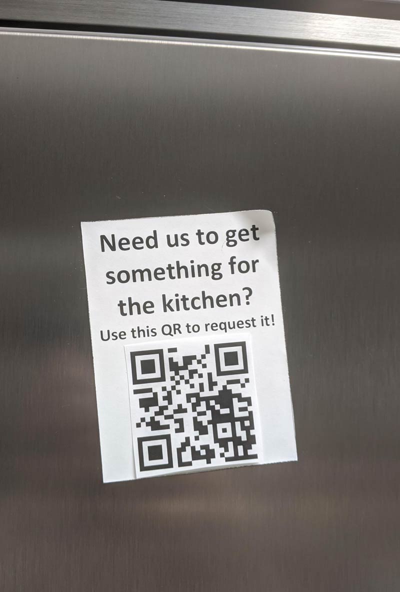 Replaced QR code on fridge at work. It goes to "Never gonna give you up" by Rick Astley on YouTube now