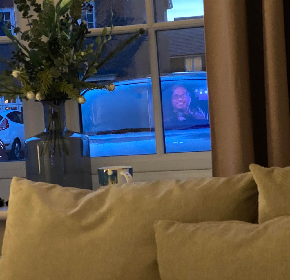 My wife looked out of our living room window and saw this.. The TV screen reflection lined up perfectly with her car