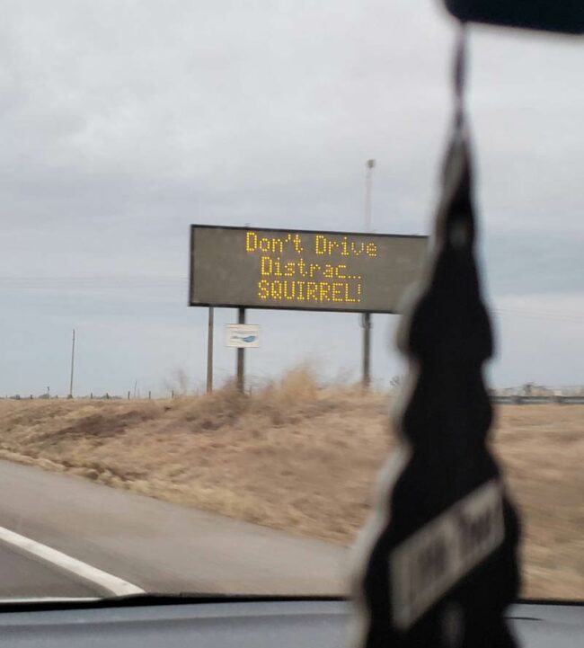 Let's put up a distracting sign to warn drivers about distractions