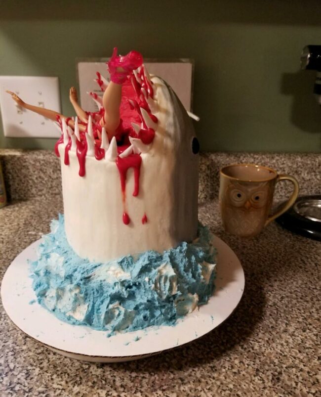 My nephew turned 6 a few days ago. He loves sharks a desperately wanted a cake that looked like a shark eating a person, so my sister made this