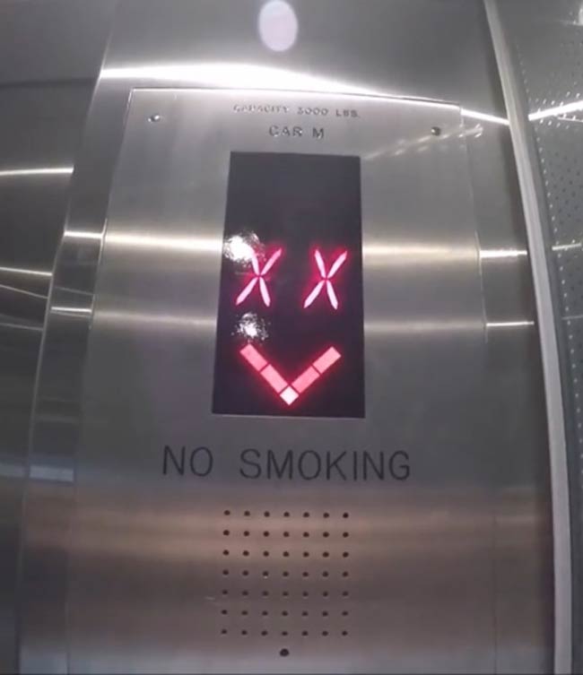 This evil smiley face on a elevator floor indicator, looks like I'm going straight to hell