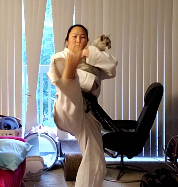 I wanted to do kicking practice. Cat wanted to be held. Here is our compromise